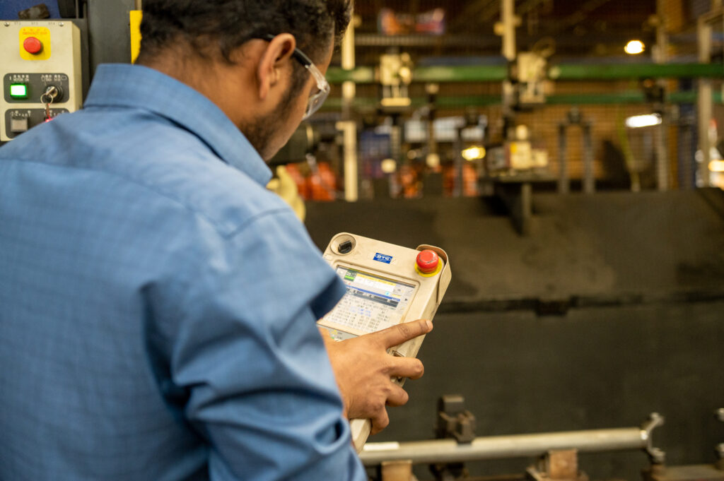 Image of diverse employee on manufacturing floor